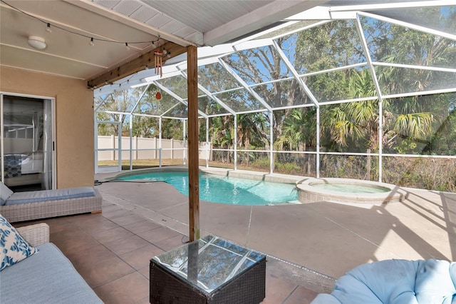 view of swimming pool with an in ground hot tub, glass enclosure, and a patio