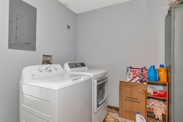 clothes washing area featuring washer and dryer and electric panel