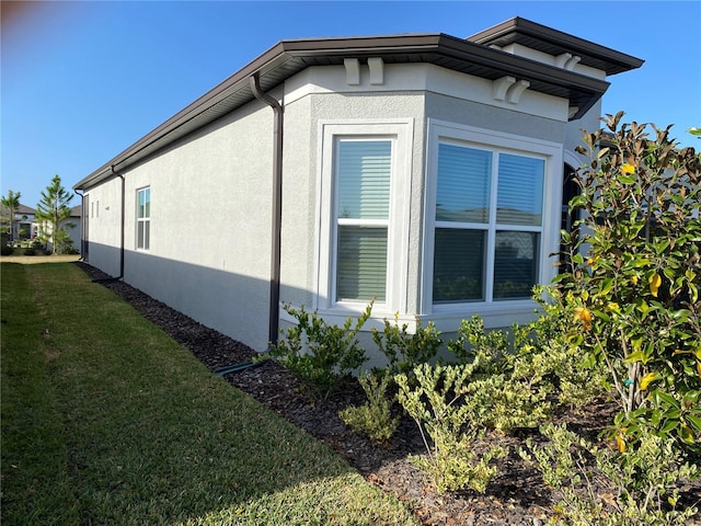 view of property exterior featuring a yard