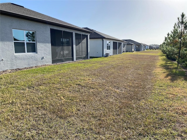 view of yard with a sunroom