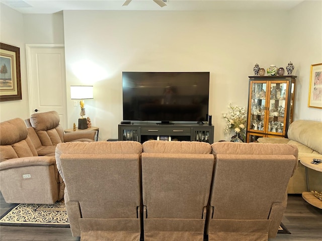 living room featuring dark hardwood / wood-style floors and ceiling fan