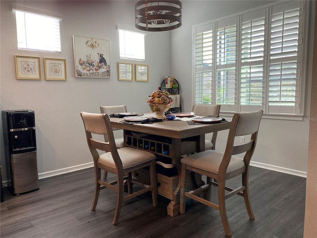 dining space with dark hardwood / wood-style flooring and plenty of natural light