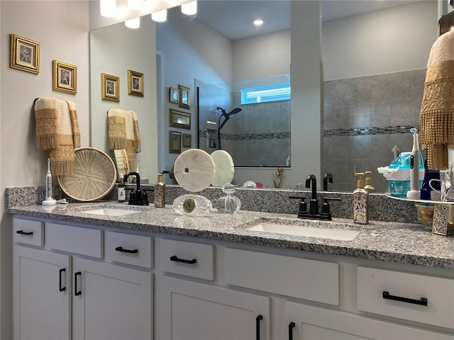 bathroom featuring vanity and a tile shower