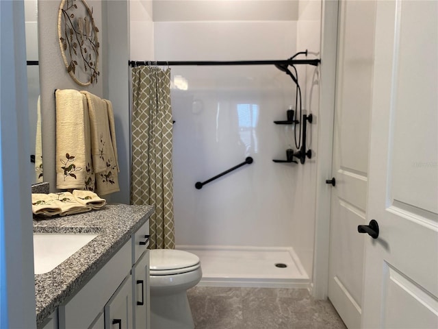 bathroom with vanity, toilet, and walk in shower