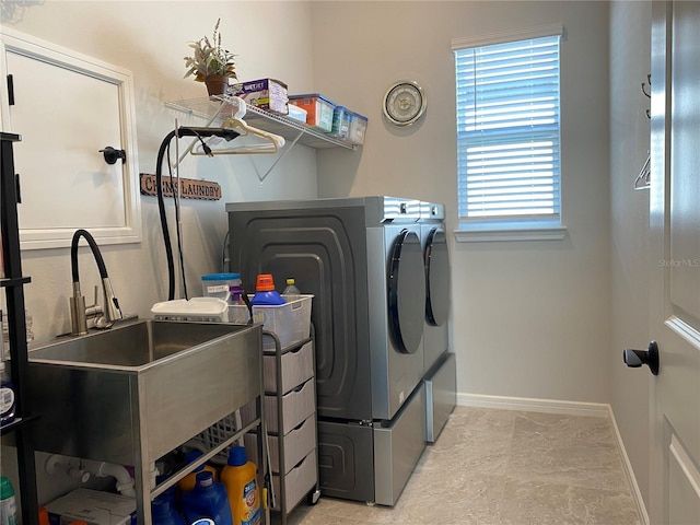 laundry room featuring sink and independent washer and dryer