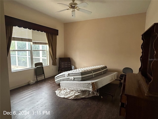 bedroom with wood-type flooring and ceiling fan