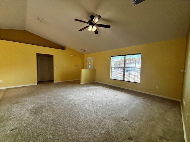 unfurnished room featuring ceiling fan, carpet floors, and lofted ceiling