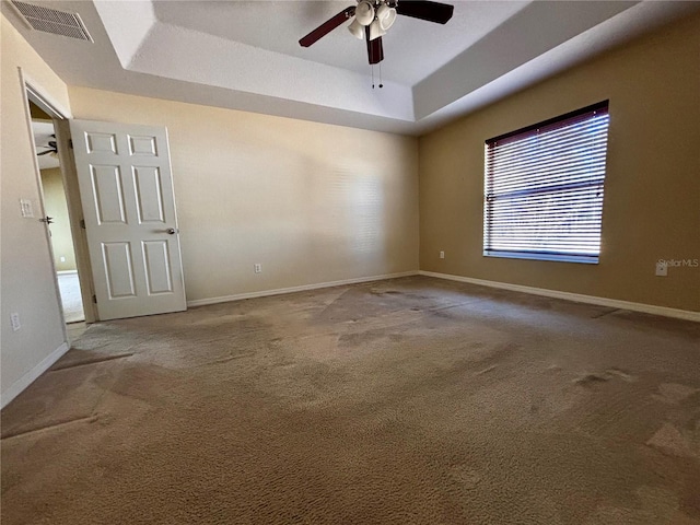 3 Redwood Run Radl, Ocala, FL 34472 - spare room featuring a tray ceiling, carpet floors, and ceiling fan