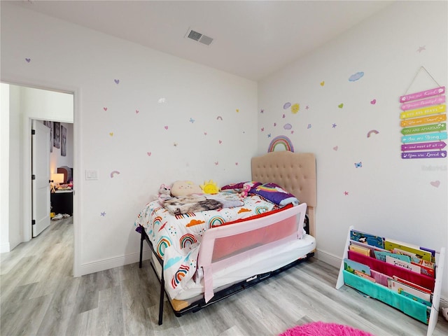 bedroom featuring light wood-type flooring