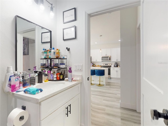 bathroom featuring vanity and wood-type flooring