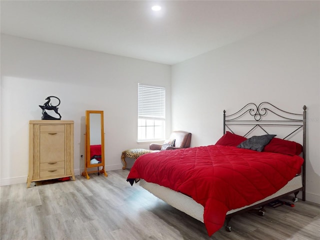 bedroom featuring hardwood / wood-style floors