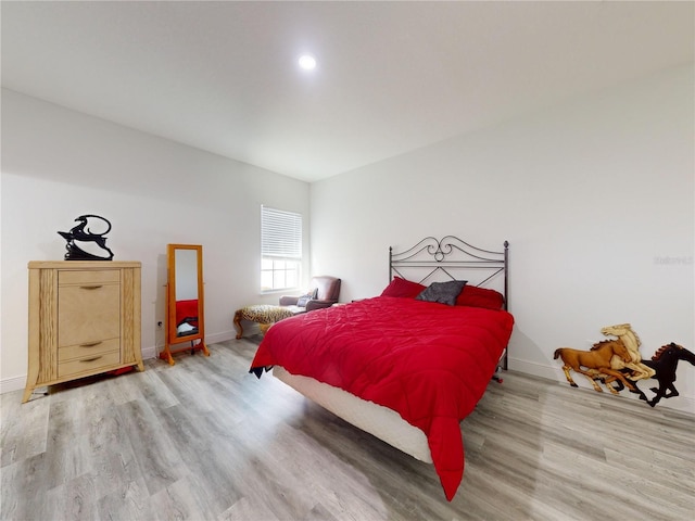 bedroom with light hardwood / wood-style floors