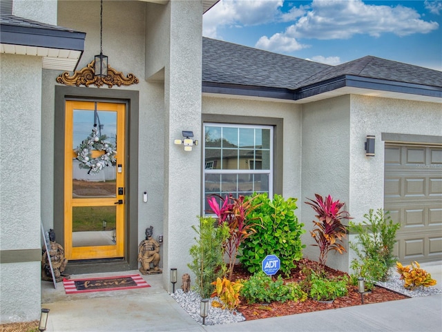 doorway to property featuring a garage