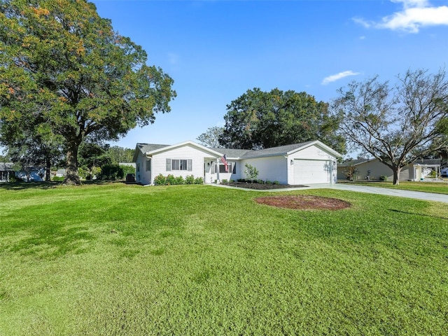 single story home featuring a front yard and a garage