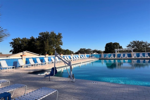 view of swimming pool with a patio