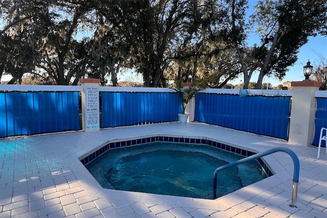 view of pool featuring a community hot tub