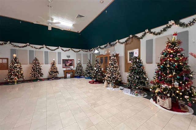 interior space with ceiling fan