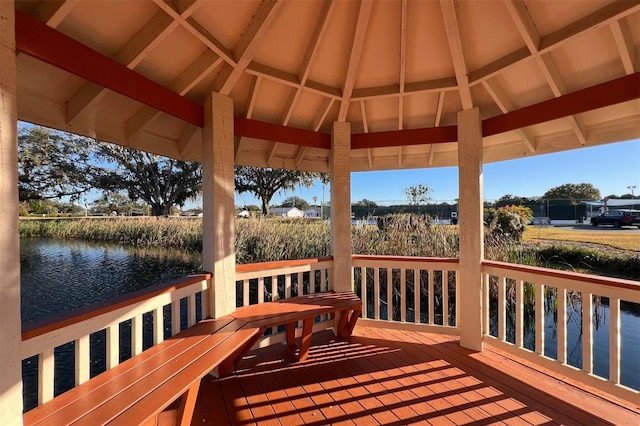 deck featuring a gazebo and a water view