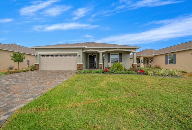 view of front facade featuring a front lawn and a garage