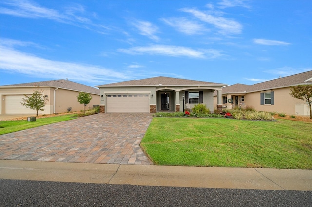 single story home featuring a garage and a front yard