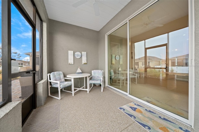 sunroom / solarium with ceiling fan