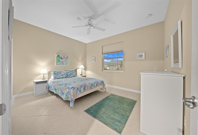 bedroom featuring light tile patterned floors and ceiling fan