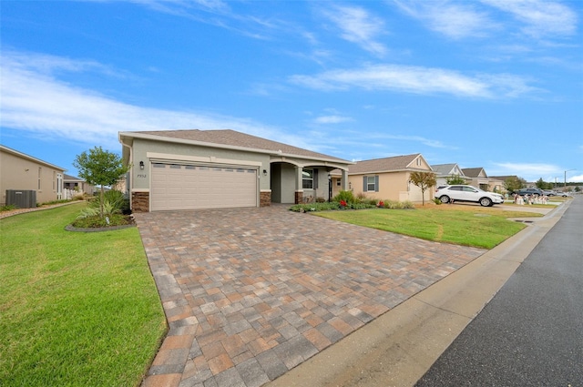 ranch-style home featuring central AC, a front yard, and a garage