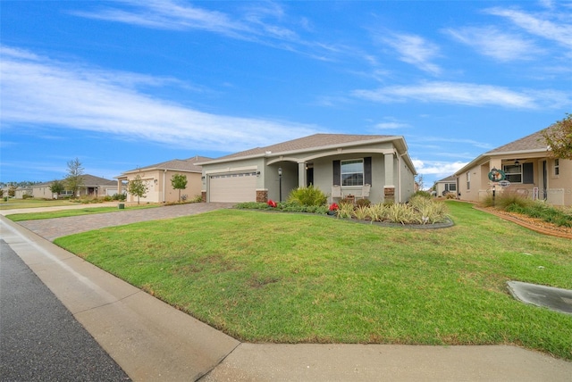 ranch-style home with a front yard and a garage