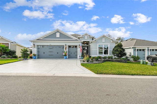 view of front facade with a garage and a front lawn