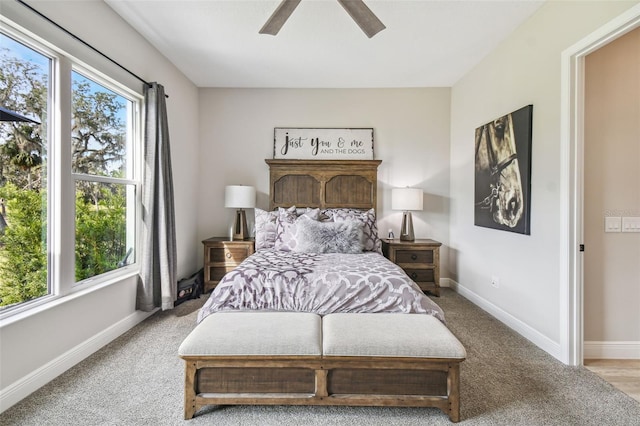 bedroom with ceiling fan and light colored carpet