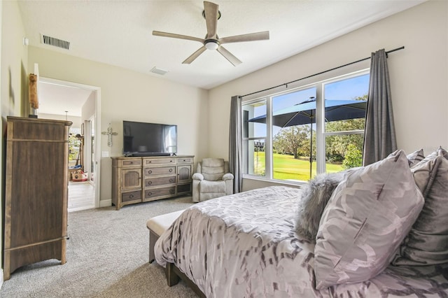 bedroom featuring light carpet and ceiling fan