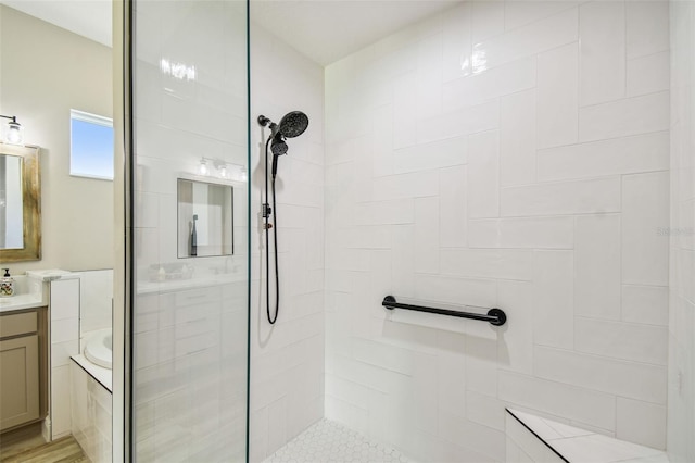 bathroom featuring hardwood / wood-style flooring, vanity, and separate shower and tub