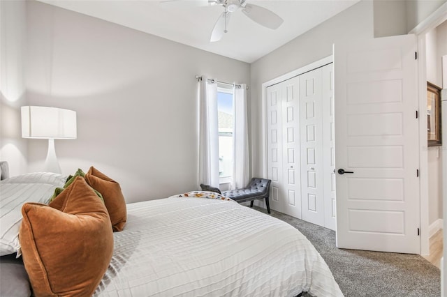 bedroom with dark colored carpet, a closet, and ceiling fan