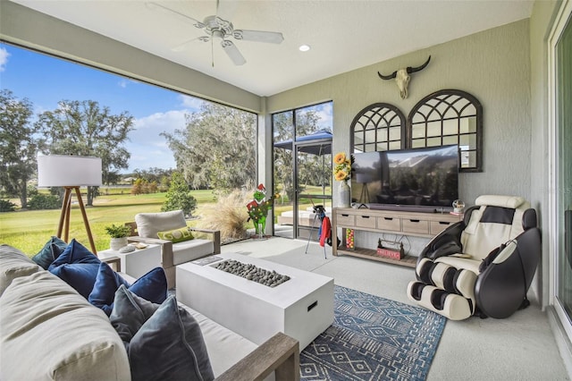 sunroom / solarium with ceiling fan