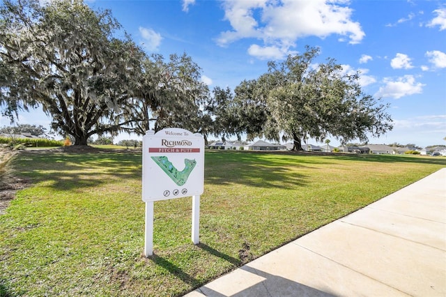 surrounding community featuring a lawn