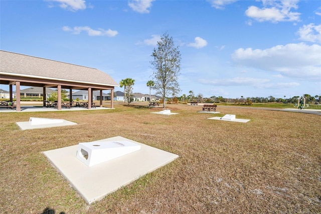 view of property's community with a gazebo and a lawn