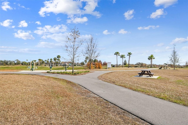 view of home's community with a lawn