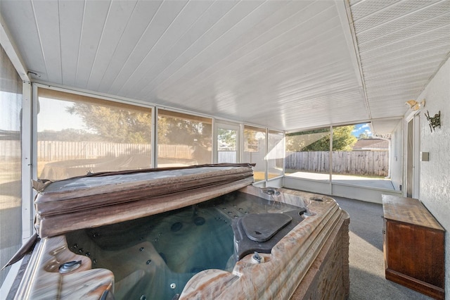 sunroom / solarium featuring a jacuzzi