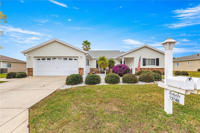 ranch-style home with a garage and a front lawn