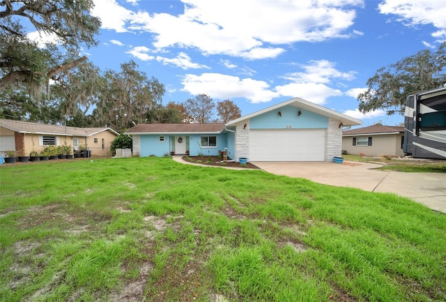 single story home featuring a garage and a front yard