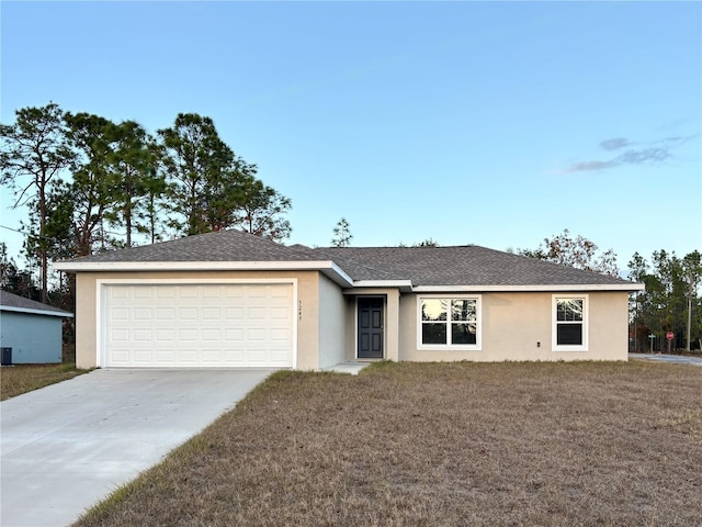 single story home featuring a garage, a front yard, and central AC