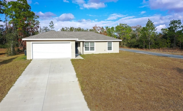 ranch-style house featuring a garage and a front lawn