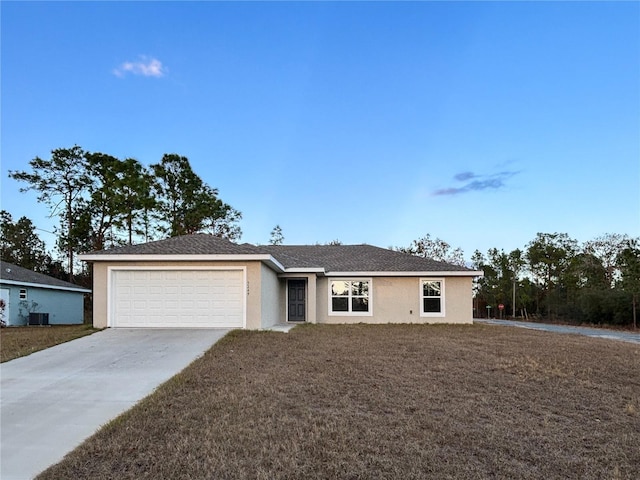 ranch-style home with a front yard and a garage