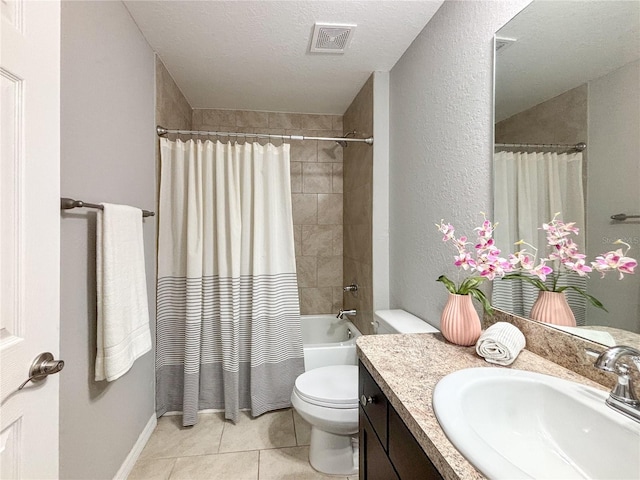 full bathroom featuring vanity, a textured ceiling, shower / bathtub combination with curtain, tile patterned flooring, and toilet