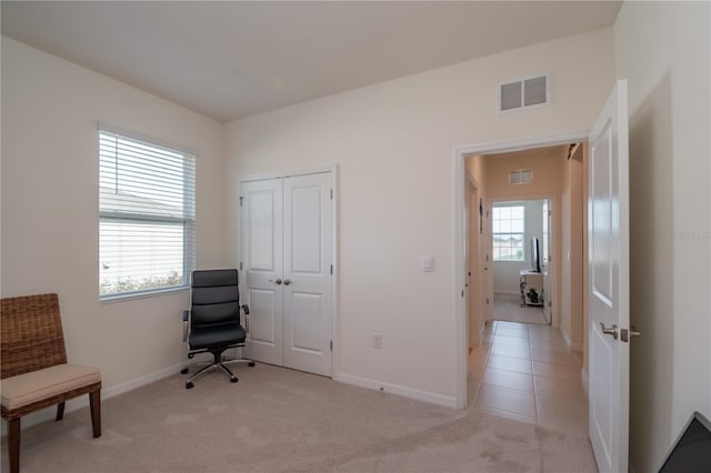 living area featuring light colored carpet