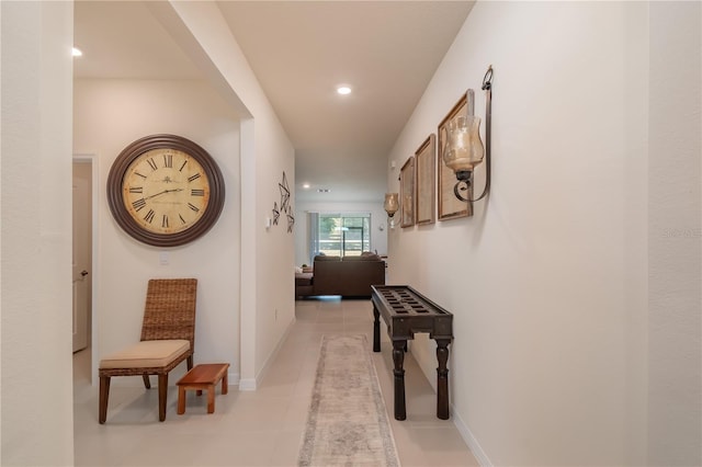 corridor with light tile patterned floors