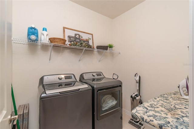 clothes washing area featuring washing machine and clothes dryer