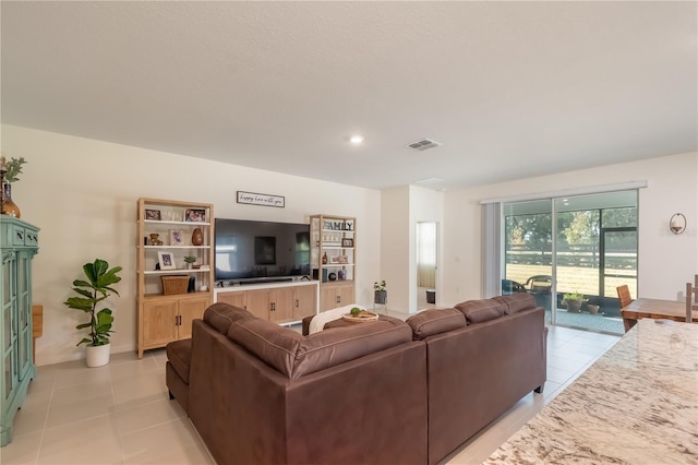 living room featuring light tile patterned flooring