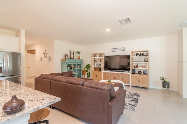 living room with light tile patterned flooring