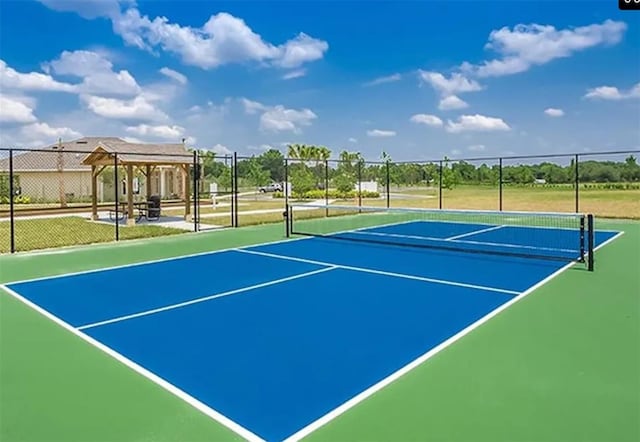 view of sport court with basketball hoop